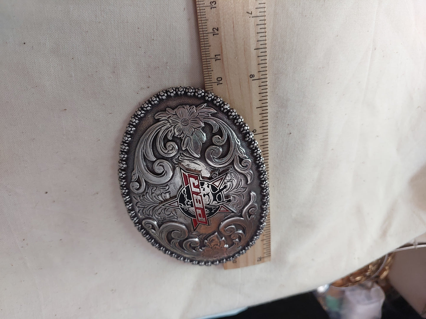 PBR Professional Bull Riders Oval Western Belt Buckle | Floral Engraved Silver Tone