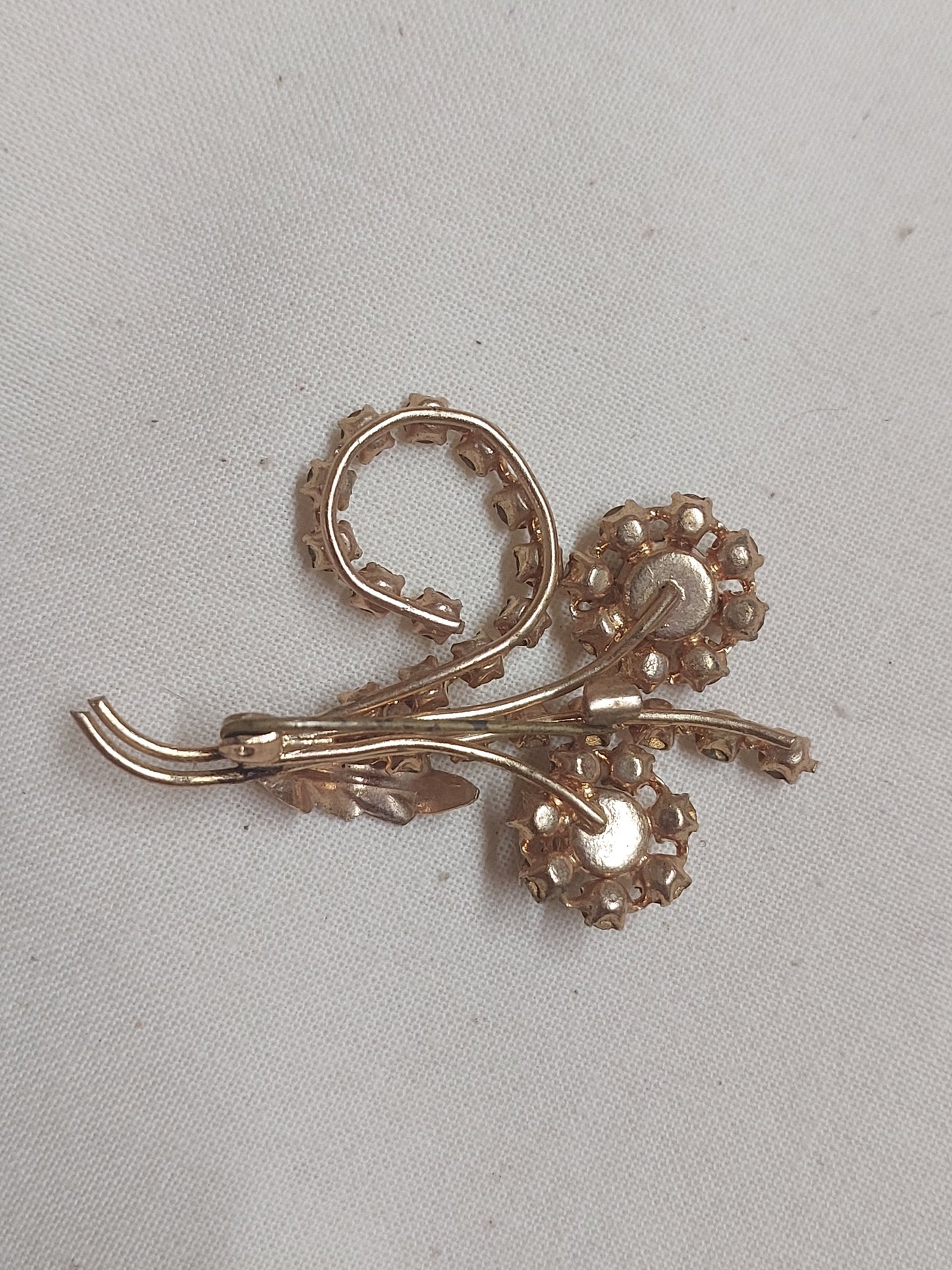 Vintage Rhinestone Floral Brooch – Green & Clear Crystal Gold-Tone Spray